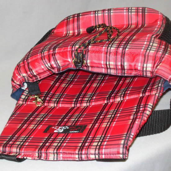 The Front Pocket Carrier laid flat, showing the harness/collar toggle.