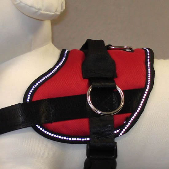 Close-up view of the left side of the Reflective No-Pull Harness in red.