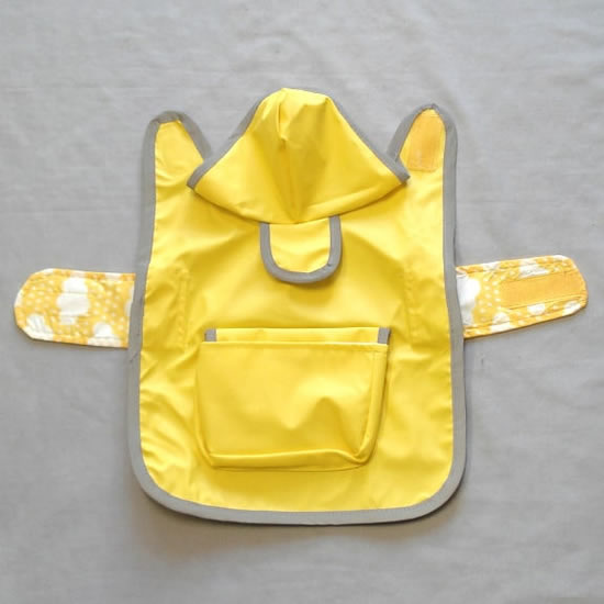 The Reversible Raincoat laid flat and open.