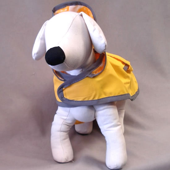 A dog mannequin showing the front of the Reversible Raincoat.