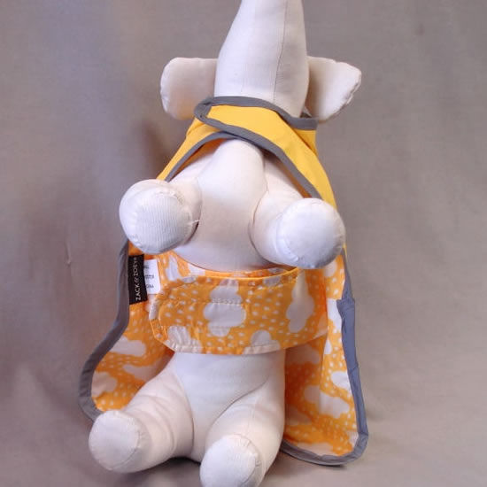 Dog mannequin showing the underside of the Reversible Raincoat.