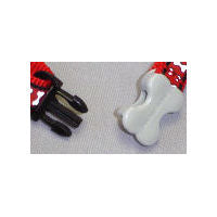 Detail of the bone-shaped pinch clasp on the Reflective Harness by Red Dingo.