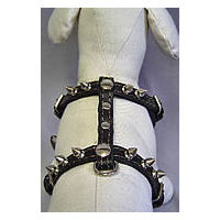 Top detail of the black Spiked Leather Harness on a white dog mannequin.