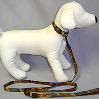 A white dog mannequin showing the Camo Ultrasuede Collar by Susan Lanci Designs.