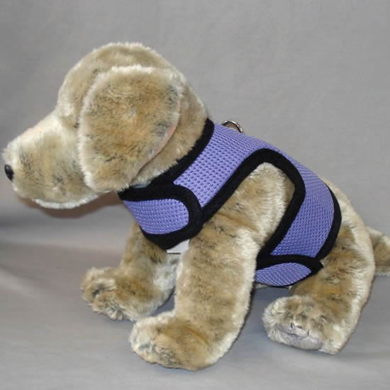 A stuffed dog toy showing the neck and tummy straps of the lavender mesh Wrap-N-Go harness.