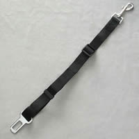 The Seatbelt Leash shown laid flat with the seatbelt insert at one end, a swivel toggle at the other end, and the length adjuster on the strap.