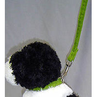 A stuffed toy dog wearing the corduroy Hemp Collar in green.